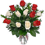 Be it any occasion or festival, 15 red and white roses in a vase as gifts will b...