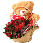 A beautiful red roses bunch wrapped beautifully in basket along with 