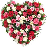 Send a beautiful heart shaped arrangement of 101 pcs multicolor roses  in this b...