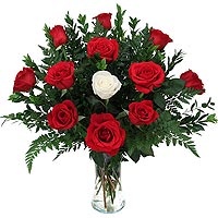 Send this a special arrangement of 11 red roses with a white/cream rose that wil...