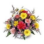 A colourful flower arrangement in a dish/in a basket....