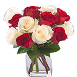 This arrangement of red and white roses in vase is the wonderful gift to send fo...