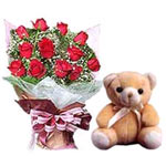  This arrangemet of red Roses vase with teddy Bear is a perfect way a gift. <br/...