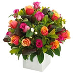 A pretty collection of fragrant roses and other stunning seasonal flowers beauti...