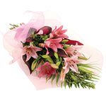 A captivating pink and green sheaf bouquet containing classic liliums and assort...