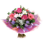 This striking pink and white bouquet composes pret...