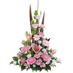 A captivating white, pink and green a-line arrangement consisting of charming li...