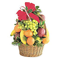 This lofty basket of fruit will make quite an impr...