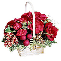 A handled basket carries red roses and red mini ca...