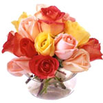 A glass bowl filled with 15 beautiful red roses, p...