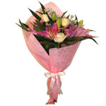 Show them you care with pink lilies and  white roses. This bouquet will keep  re...