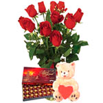 Send this pretty arrangement of  11 red roses, handmade chocolates and  Teddy Be...