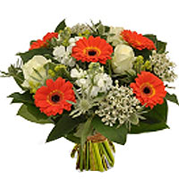 Compact beautiful bouquet of white and orange flowers. The orange gerberas provi...
