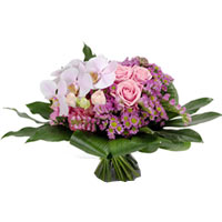 A gallant display of pink and purple that includes roses, mums, Santinis and the...