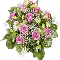 Lovely round tied bouquet of pink roses and seasonal white flowers....