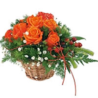 This beautiful roses are bountifully displayed in a natural wood basket to to ce...