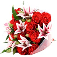 This bouquet made of red roses Absolutely charming and fragrant pink lilies Empe...
