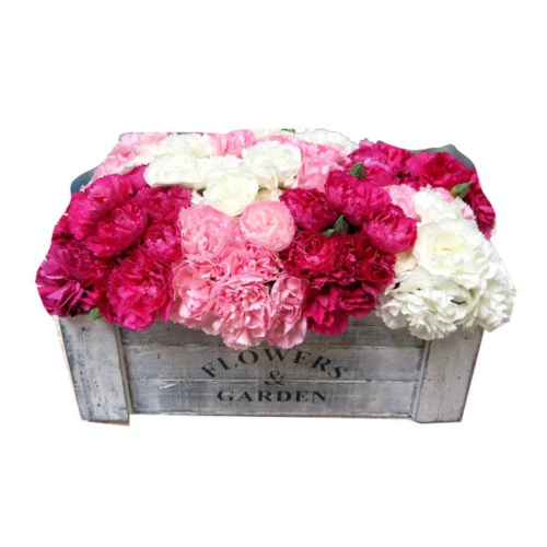 The carnation centerpiece in a wooden box is the p...