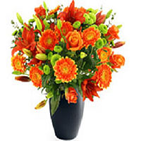 A nice Blumenschrauss in orange as orange gerberas lilies and beautiful accessor...