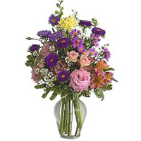 The clear glass vase accentuates the wonderment of......  to flowers_delivery_thurso_canada.asp