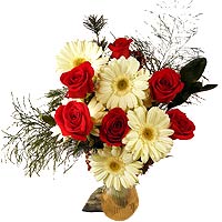 This beautiful New Year arrangement of exquisite r......  to flowers_delivery_malartic_canada.asp
