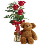 Three sweet roses in a glass bud vase arrive with ......  to flowers_delivery_orillia_canada.asp