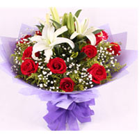 Exotic Coastal Display of Roses N Lilies<br/><br/>