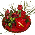 An ambudence of flowers in red and greens makes a ......  to flowers_delivery_serron_greece.asp