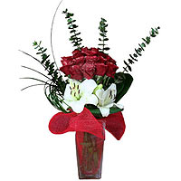 This amazing bouquet of crisp white lilies and 20 deep red roses holding Mary as...