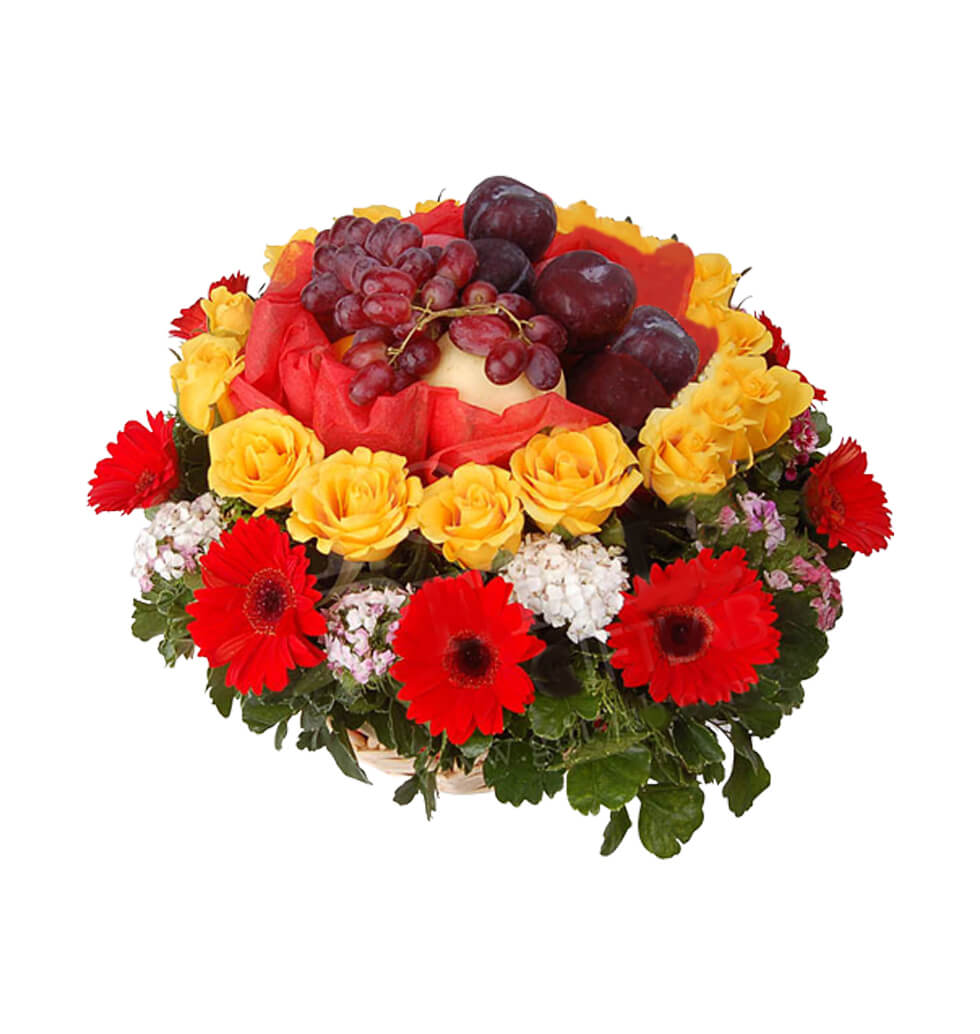 Roses and gerberas around a basketof fruit in the......  to ampang_malaysia.asp