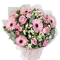 Bouquet of beautiful pink roses and gerberas ao make this whole a beautiful crea...