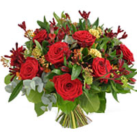 Bouquet composed of warm red flowers. ...