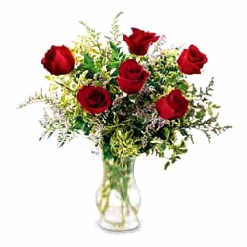 6 pcs red roses w/ greenary in a glass vase......  to bago