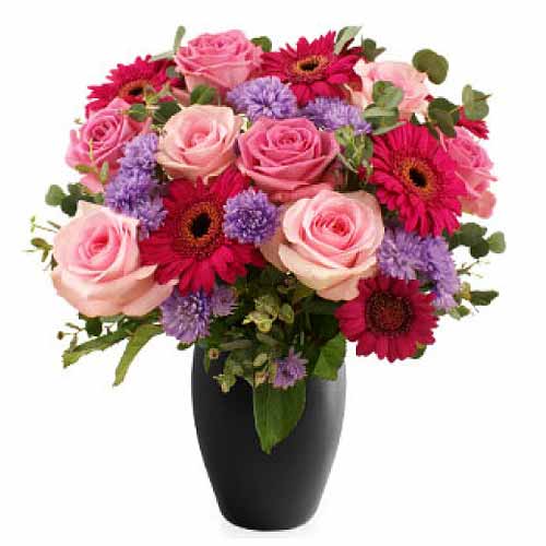 Adorable Fresh Cut Flowers in a Vase.<br>- Pink Ro......  to bago