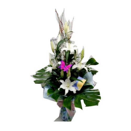 Fresh white tulips and lilies in a water vase. The......  to murcia_florists.asp