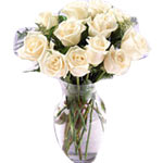 Arranged with imperial style and class magnificent white roses in a vase to make...