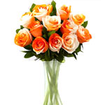 An awesome array of orange roses is blooming in a glass vase.<br/>Note:- Deliver...