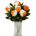 Showcasing  vibrant orange with lush greens in a glass vase is sure to be a wond...